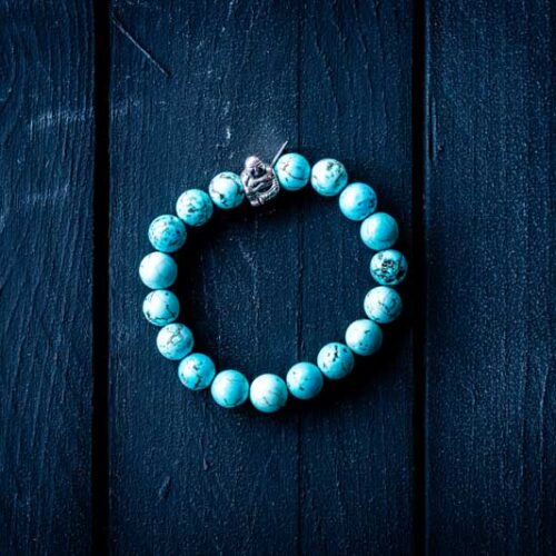 Kralen armband turkoois met zilveren happy buddha