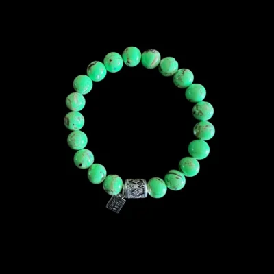 Kralen armband howliet appelgroen met tibetaanse bedel