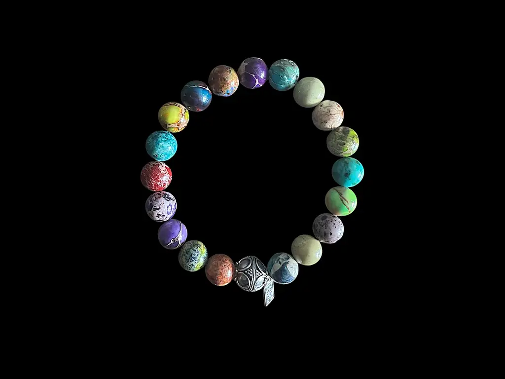 Kralen armband zeesediment mix 2 met zilveren geluksballetje 1 Kralen armband zeesediment mix 2 met zilveren geluksballetje