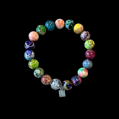 Kralenarmband zeesediment multicolour met tibetaans geluksballetje